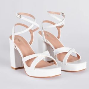 New without tags. never worn, white, criss cross platform block heels , size 7